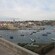 Boats docked in the harbor of an old city